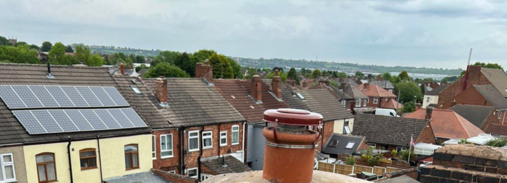 This is a photo taken from a roof which is being repaired by MCM Roofing Repairs Hook, it shows a street of houses, and their roofs