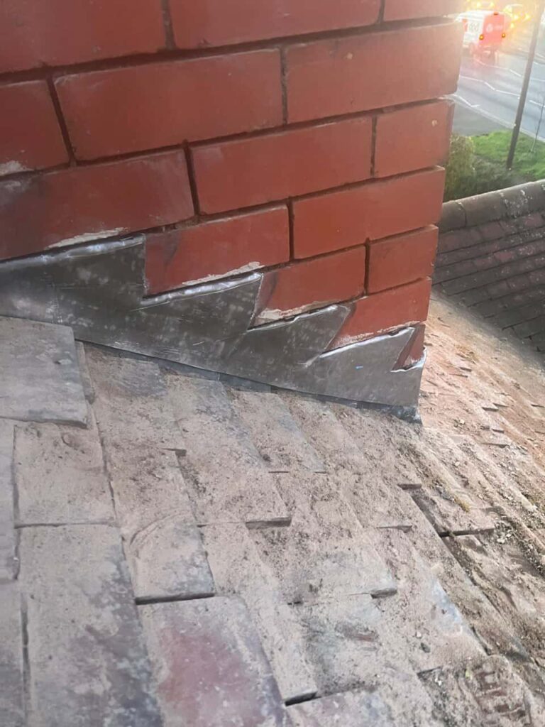 This is a photo of new leadwork being installed around an old chimney. Works carried out by MCM Roofing Repairs Hook